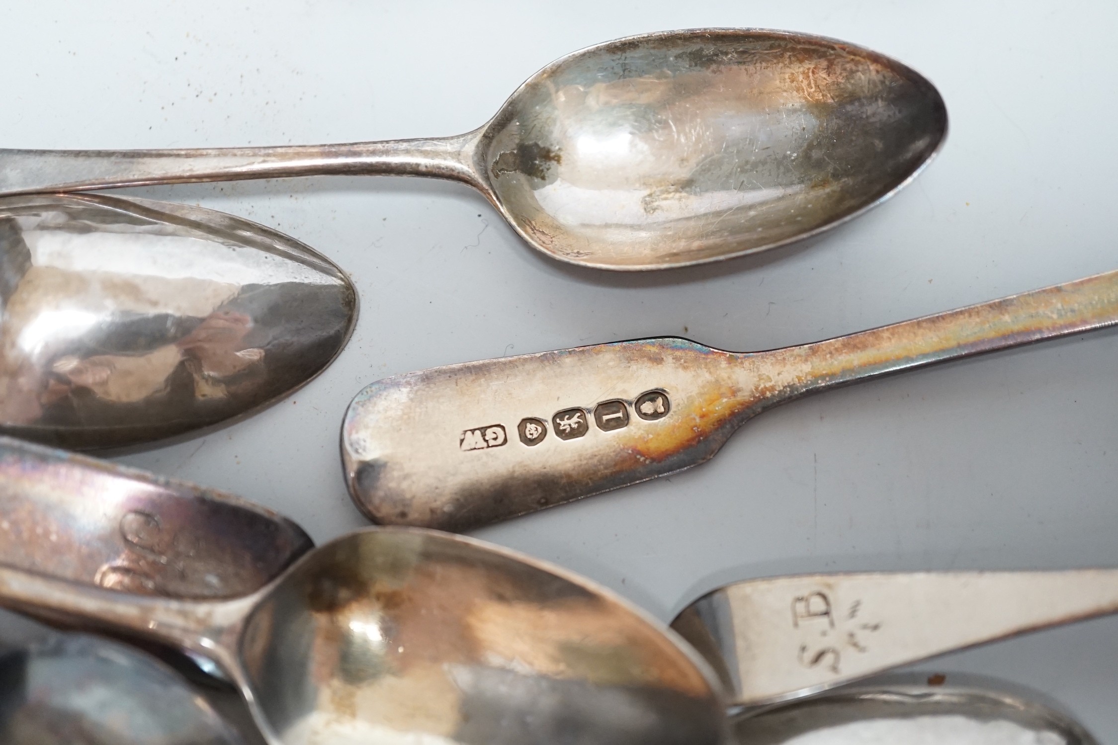 Sundry silver items, including a 1930's silver presentation cup, height 10.9cm, five silver or white metal mounted glass toilet jars, two silver napkin rings, two compacts, silver flatware and two Chinese white metal nap